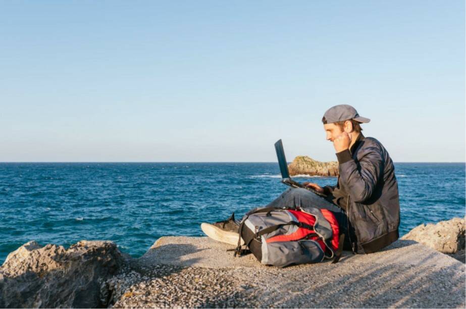 A digital nomad working near the ocean.