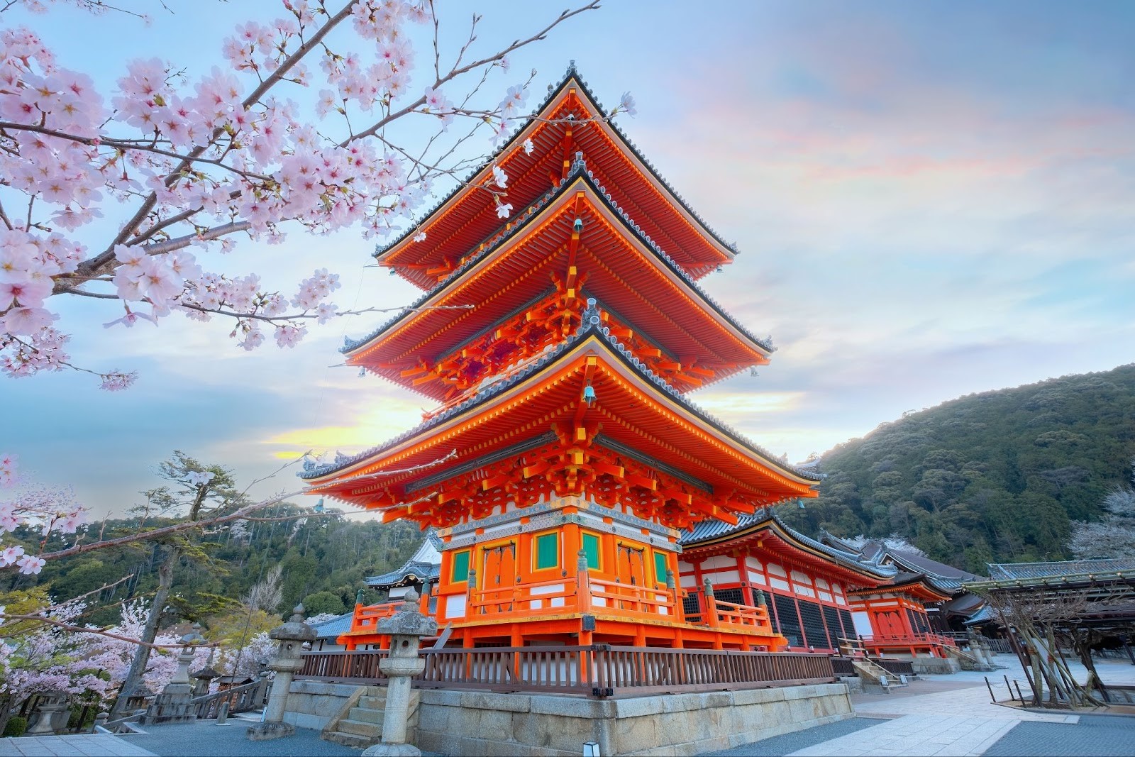 A bright day at the Buddhist temple, Kiyomizu-dera, in eastern Kyoto, Japan, during cherry blossom season.