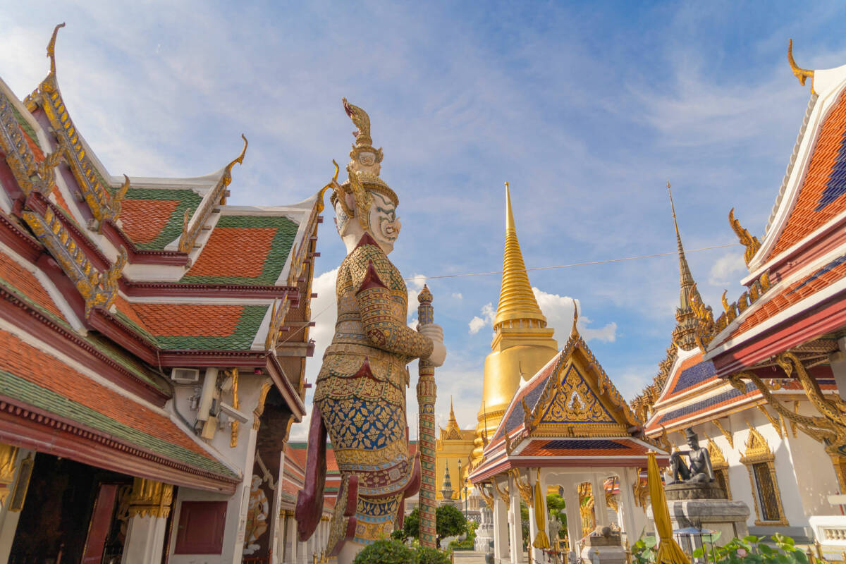 View the Golden pagoda at the Temple of the Emerald Buddha in Bangkok, Thailand.