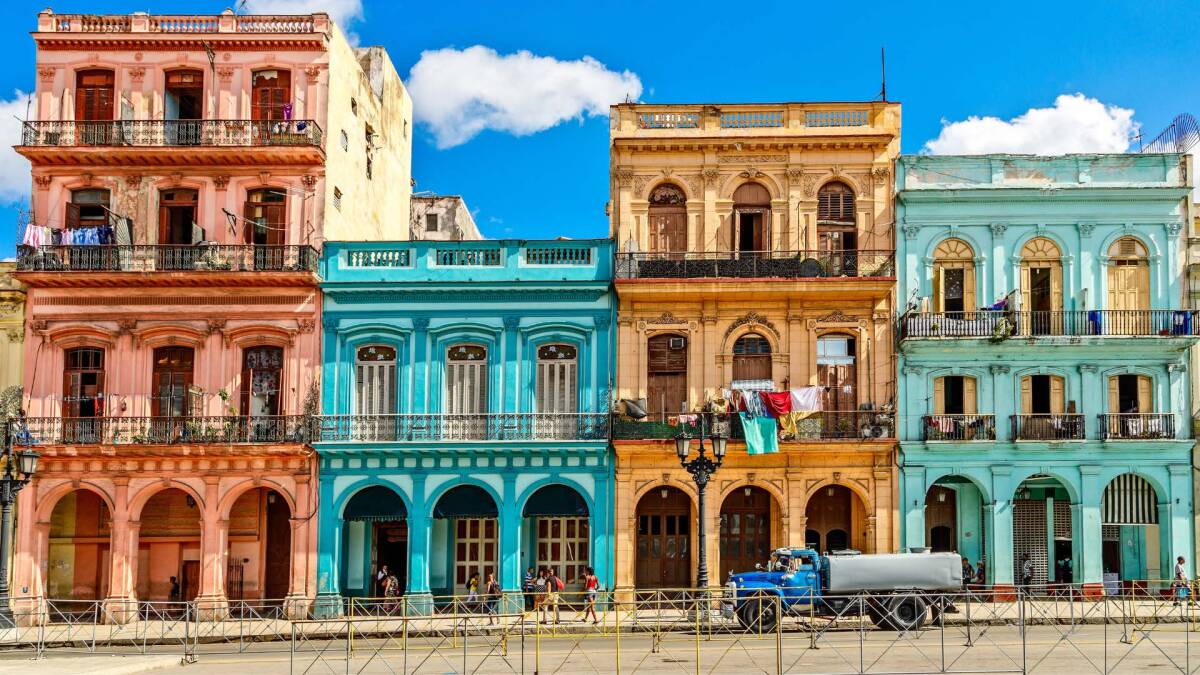 View of colorful buildings on the street in Havana, Cuba.