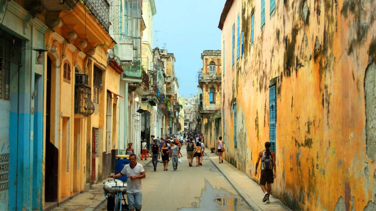 Street view of colorful buildings on a street in Havana, Cuba.