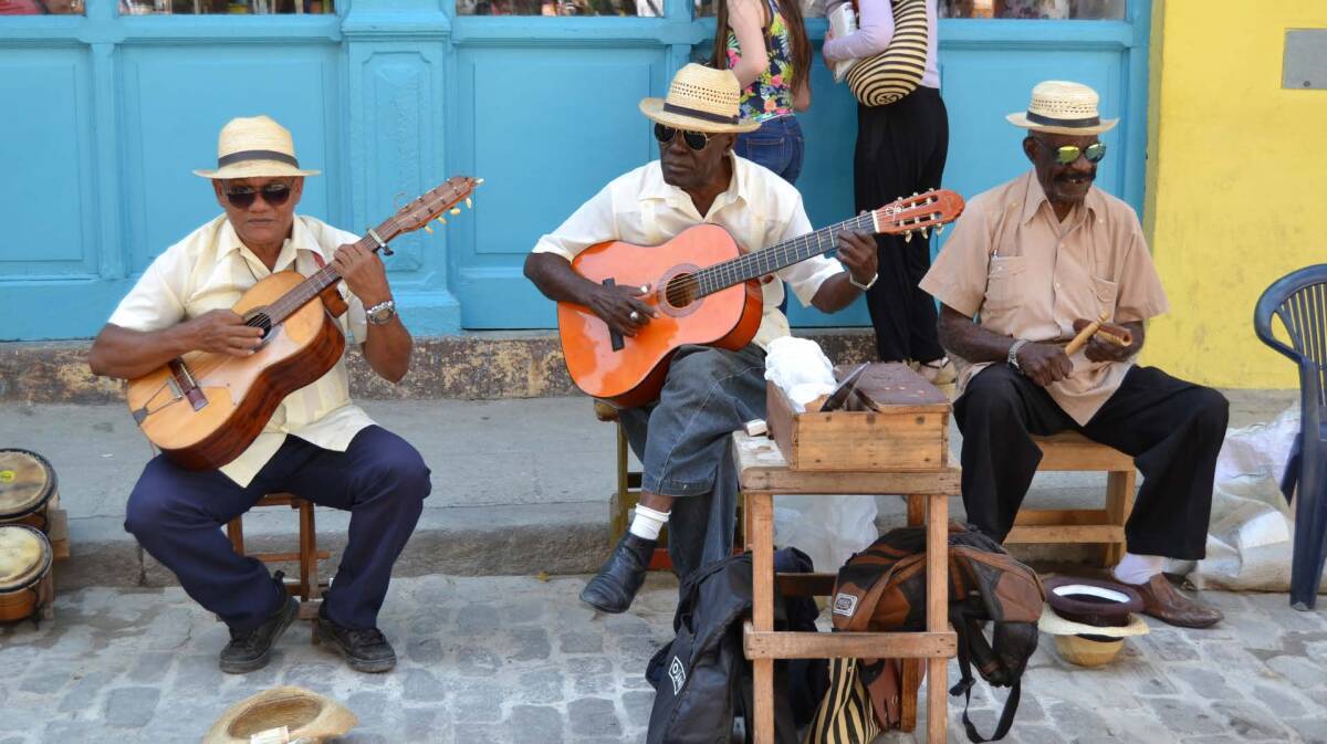 Group of performers playing guitar on the street in Havana, Cuba.