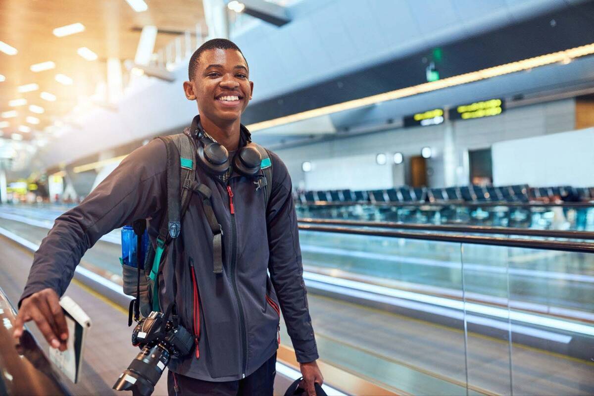 A frequent flyer at the airport, ready to board his flight for his trip.