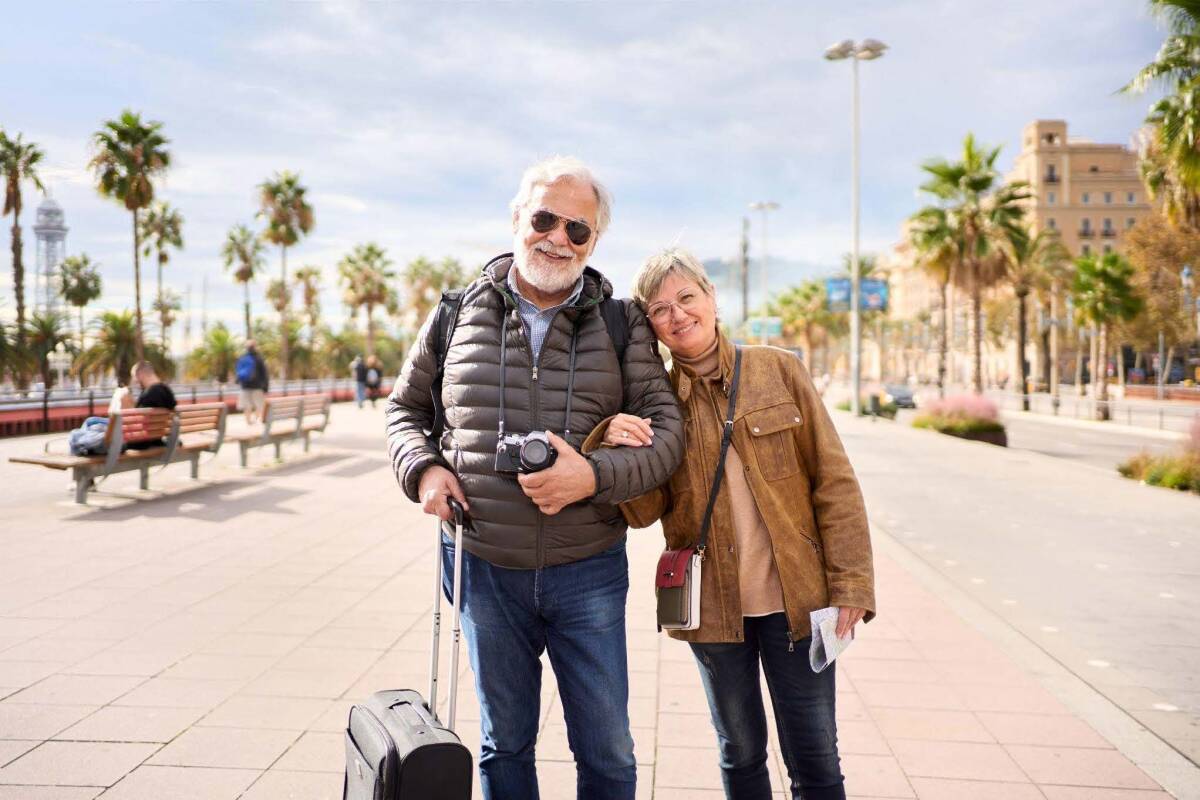 A baby boomer couple enjoying their trip, illustrating the advantages of cheap travel insurance for older generations.