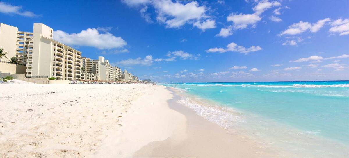 Cancun, Mexico, offers a stunning tropical escape with its     pristine beaches and vibrant blue ocean waters.