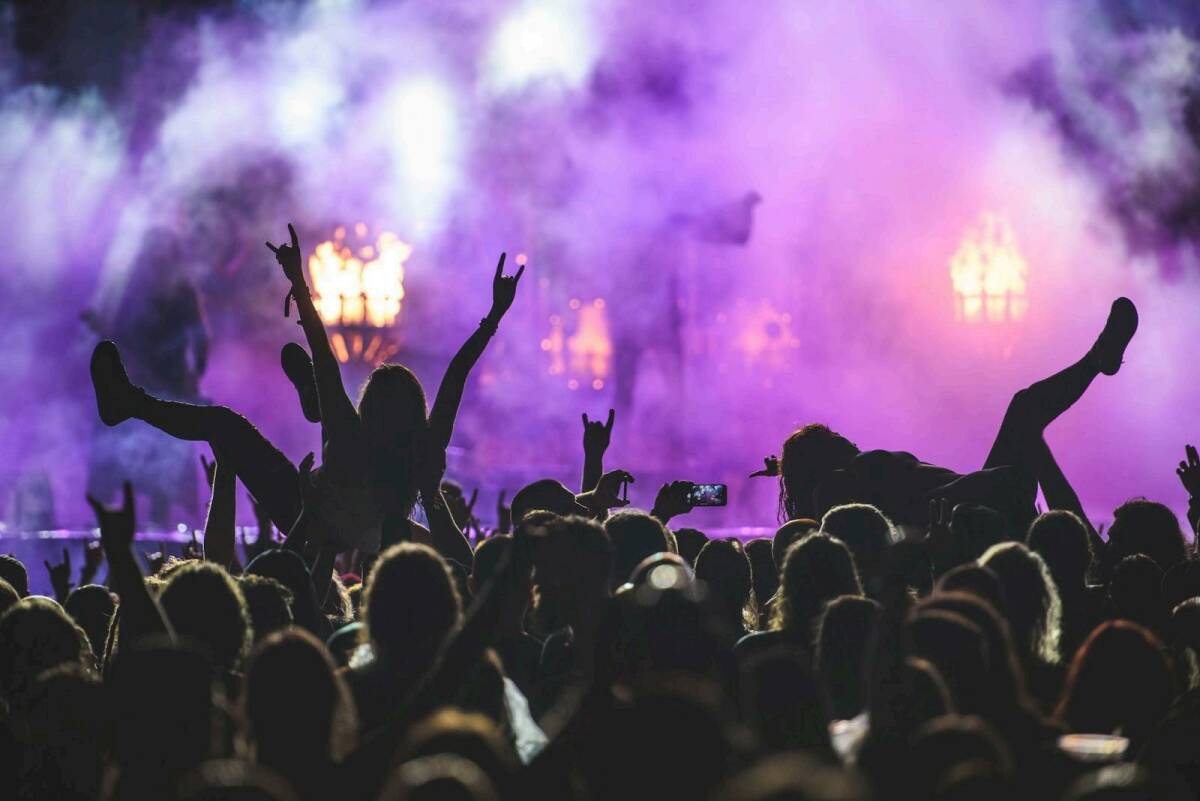 Crowd surfing and live music energy at a festival